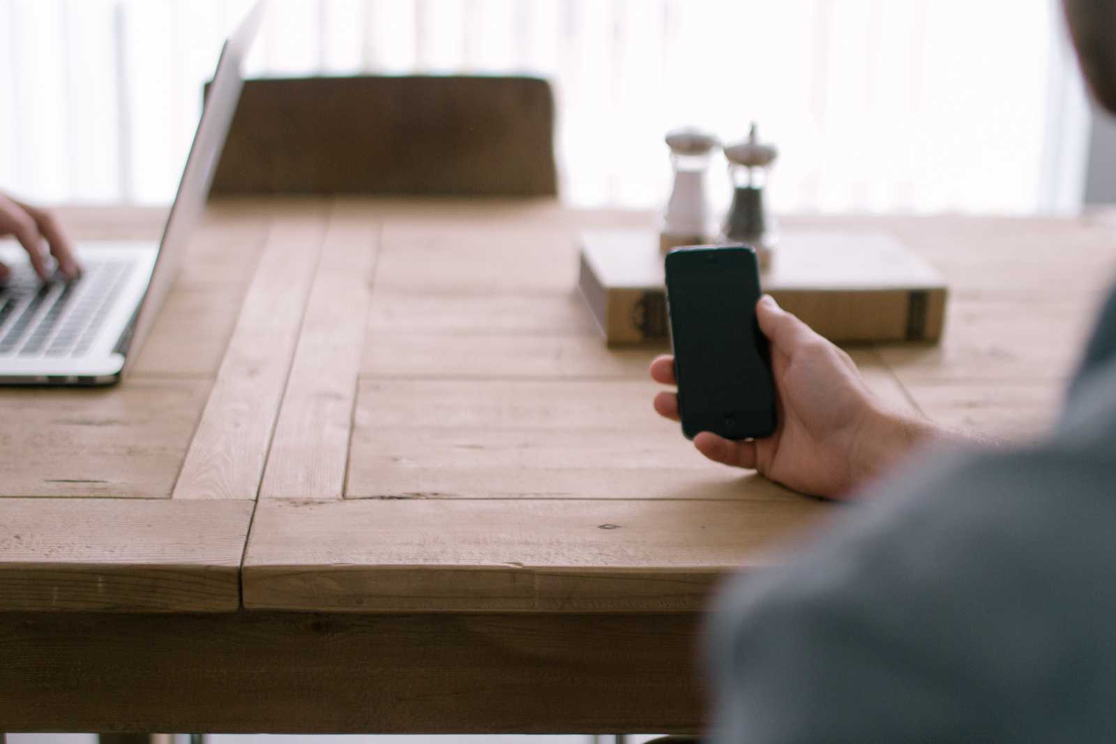 Image of a man holding a mobile